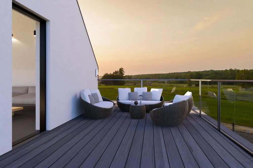 Finished rooftop terrace with sofas at sunset